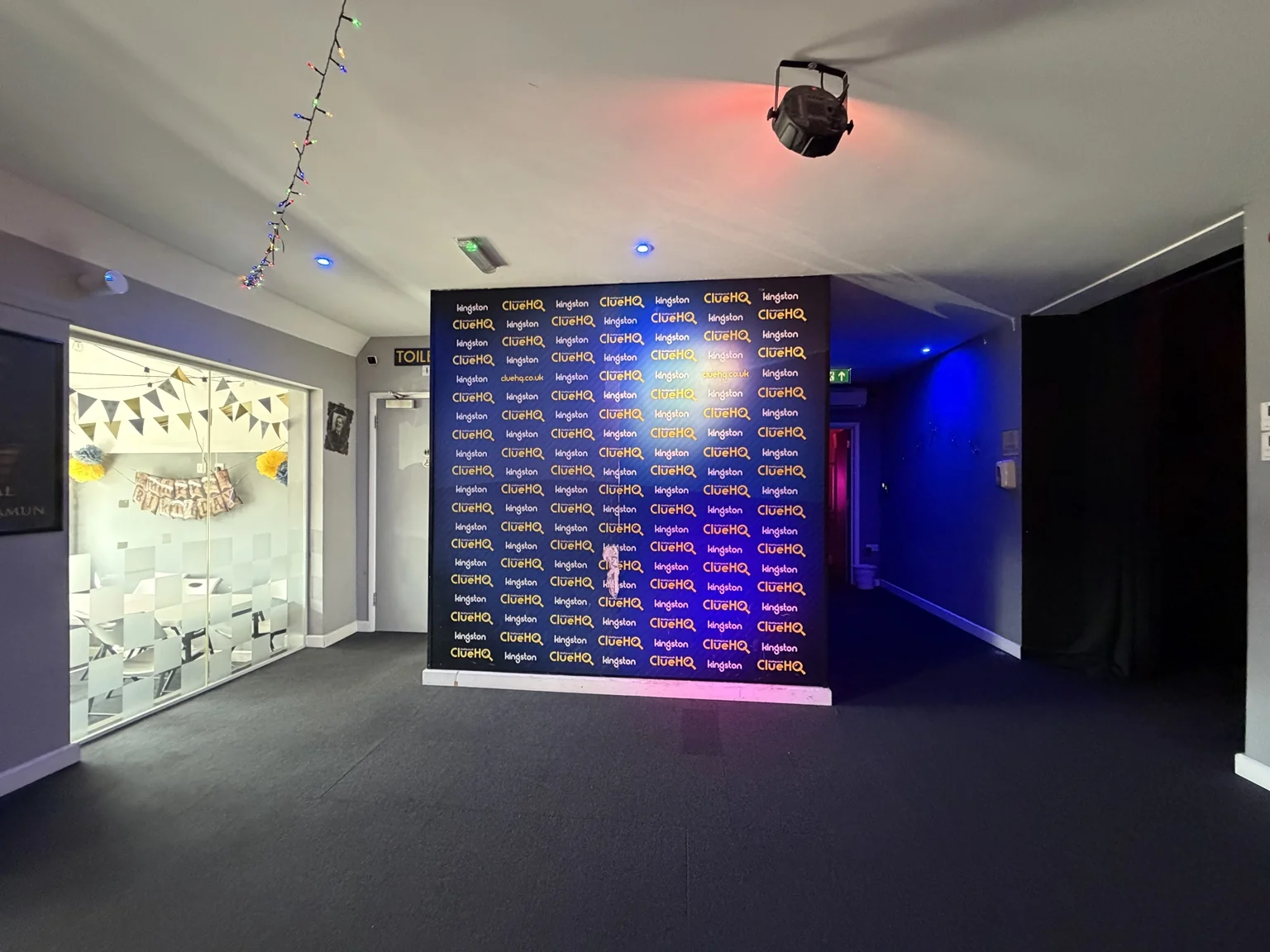 ClueHQ Kingston branded team photo wall and venue corridor